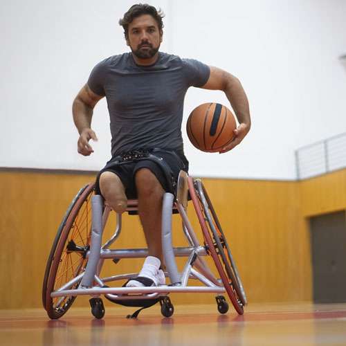 man playing wheelchair basketball