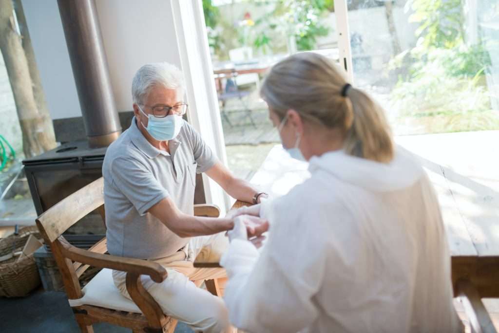 carer helping man