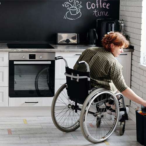 woman in wheelchair in kitchen