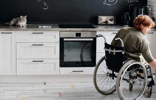 woman in wheelchair in kitchen