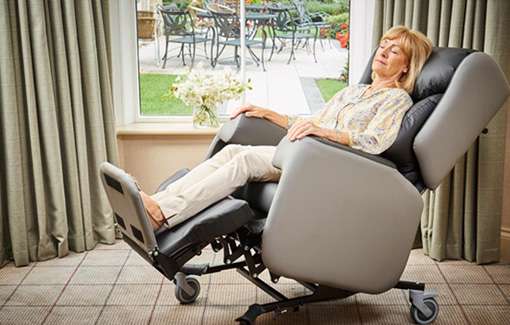 lady sleeping in care chair