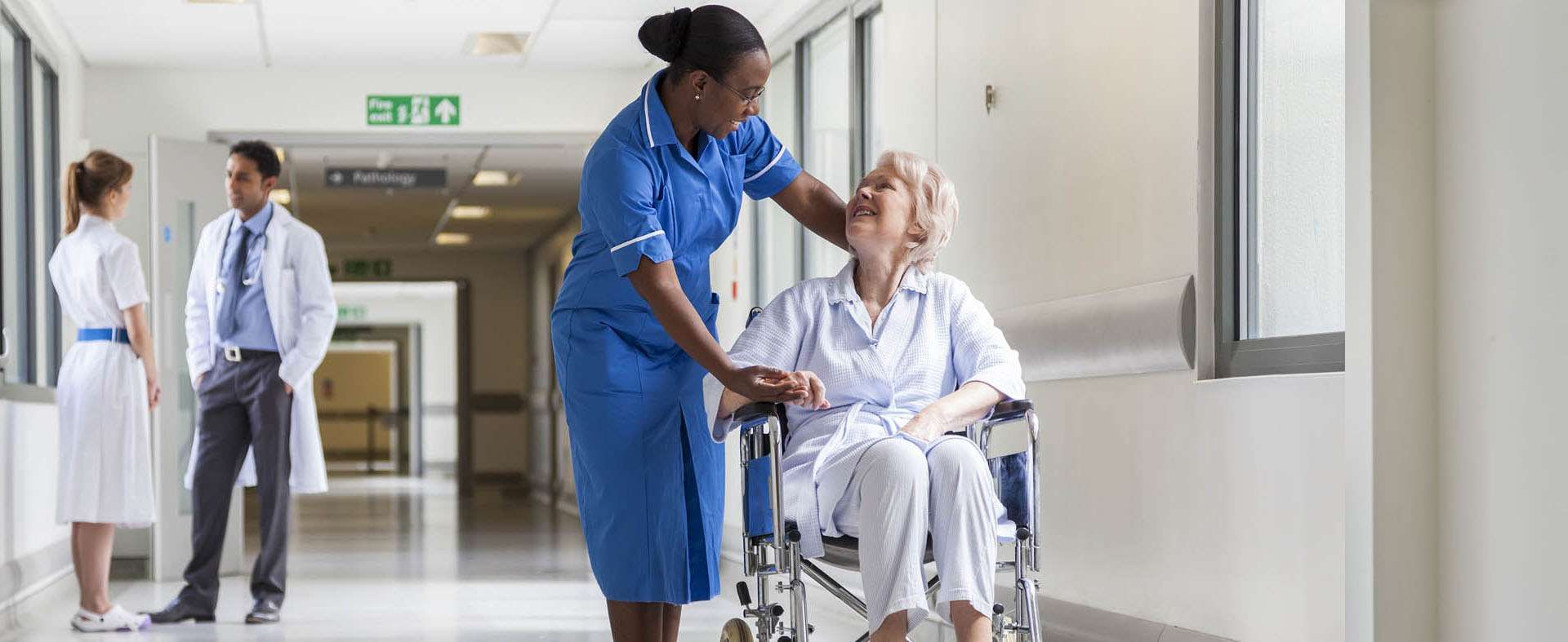 NHS Nurse in Hospital Corridor Acute