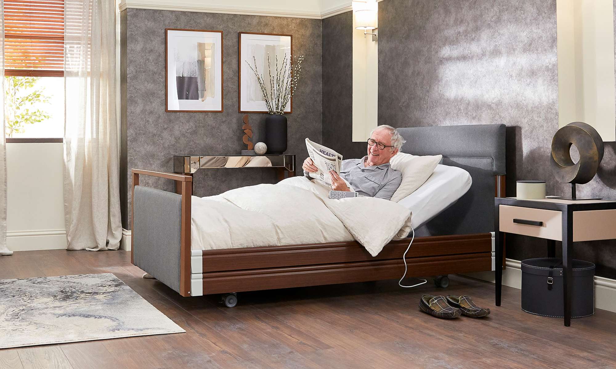 Elderly man on an electric profiling bed