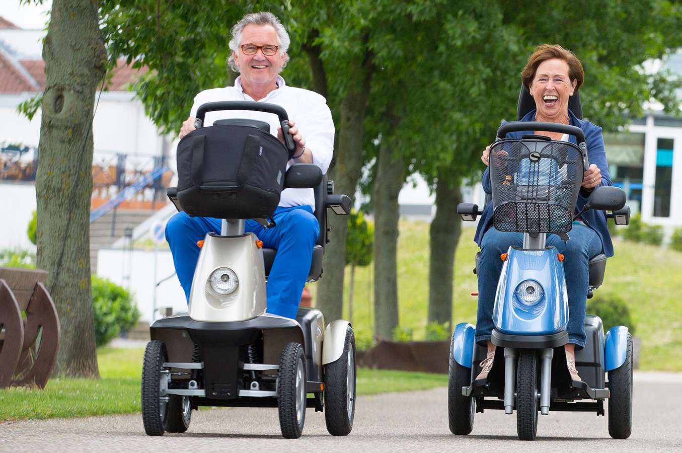 A couple out driving mobility scooters to test how they feel.