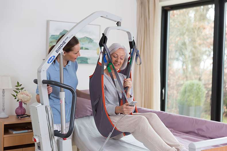 A mobile hoist can support carers with moving and handling