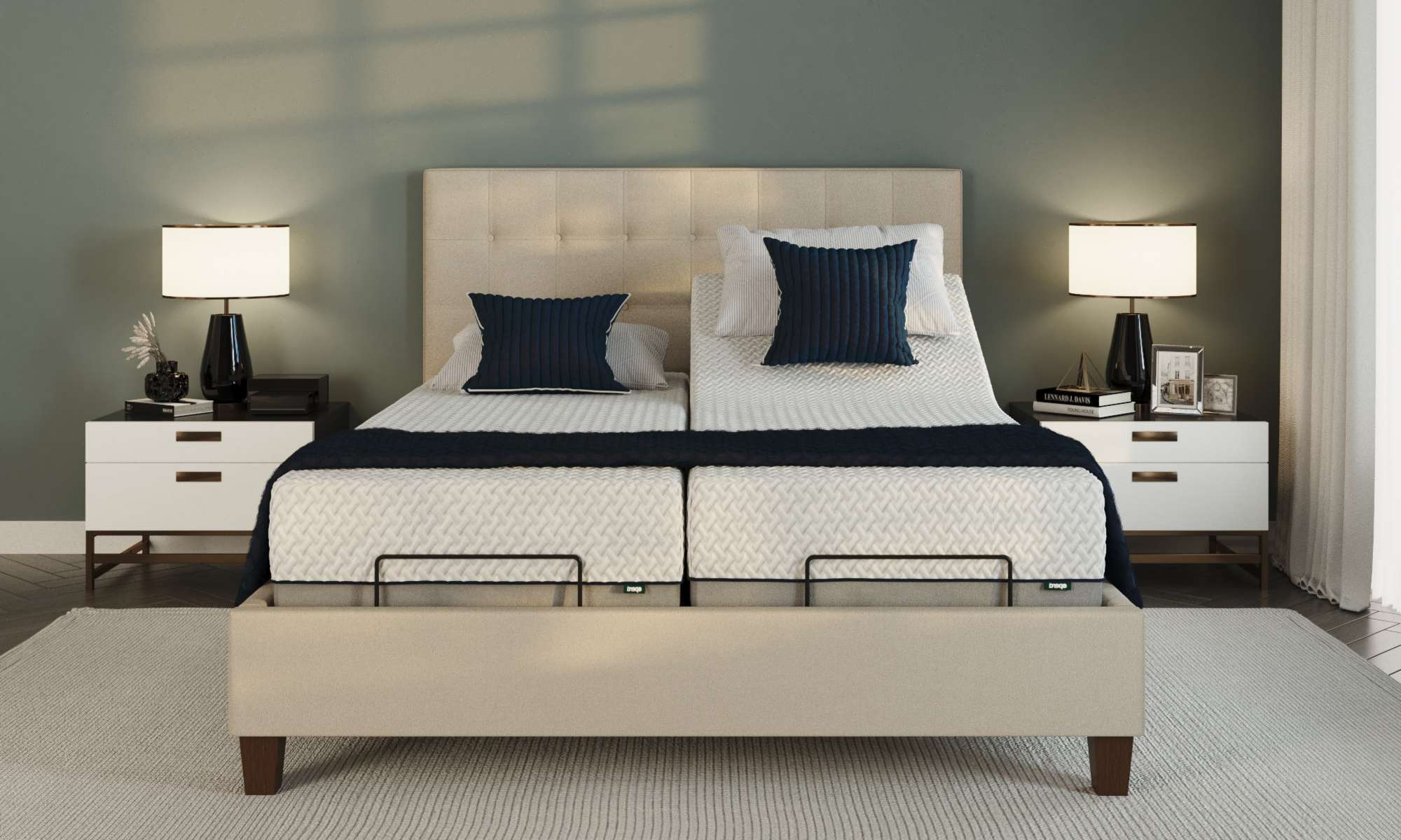 Lifestyle shot of a double electric adjustable bed in a carpeted bedroom.