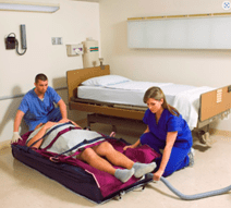 Flat patient lift kit being used in a patient in a hospital.