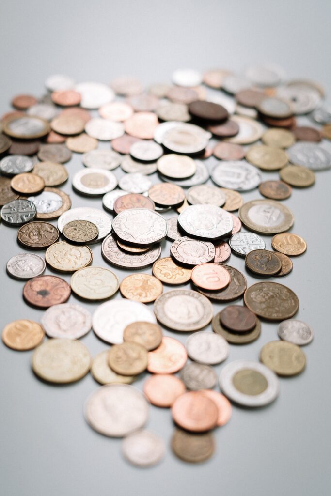 A picture of coins spread out on a table.