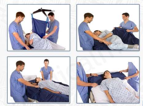 two nurses using a slide sheet to turn a female patient in bed.