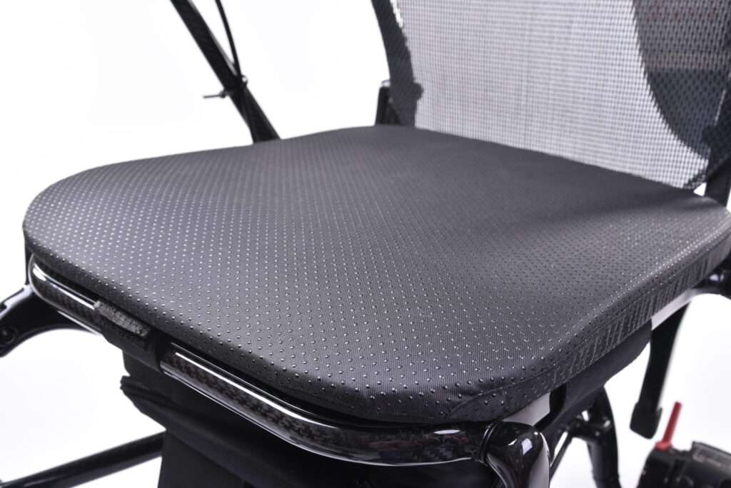 Close up of the seating area of the Quickie q50r lightweight carbon fibre foldable compact wheelchair.