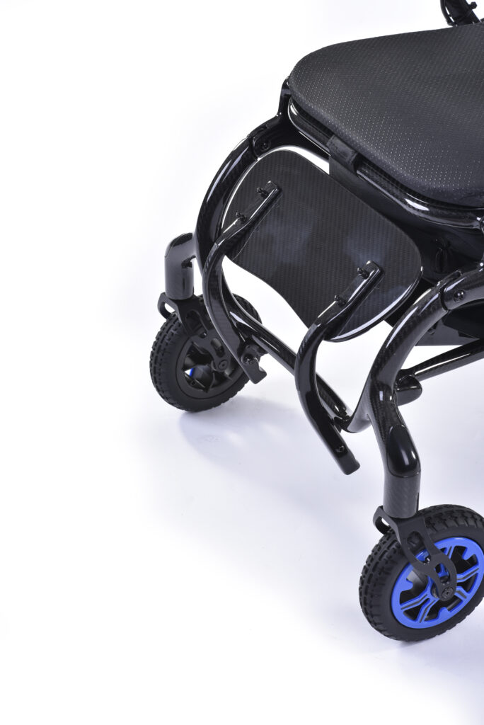 Close up of the footrest of the Quickie q50r lightweight carbon fibre foldable compact wheelchair. Footrest is flipped up.