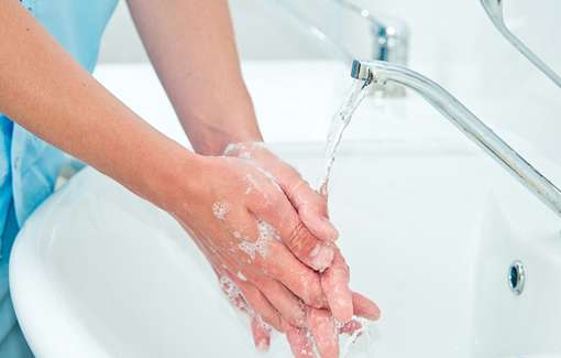 person washing hands