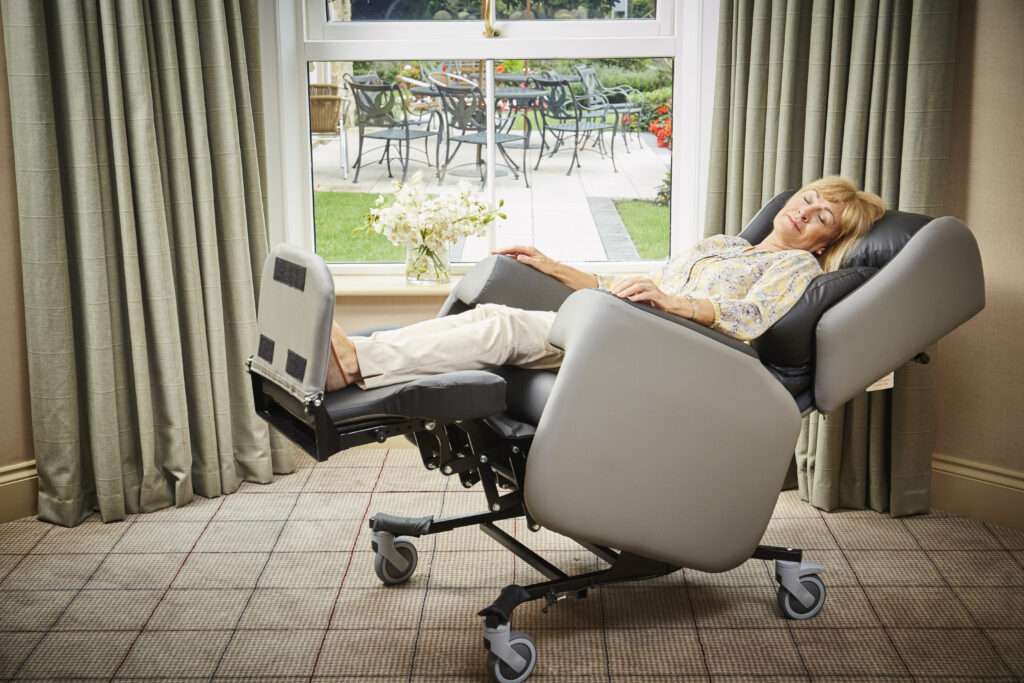 women sleeping in a chair
