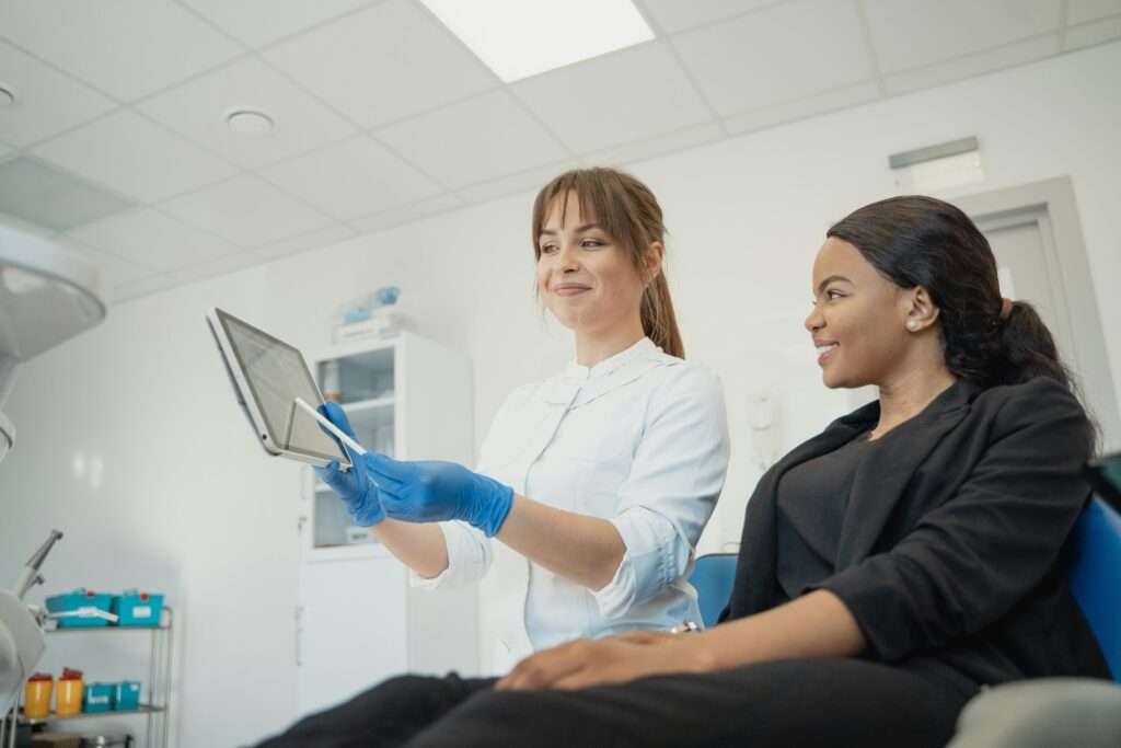nurse showing patient something on screen