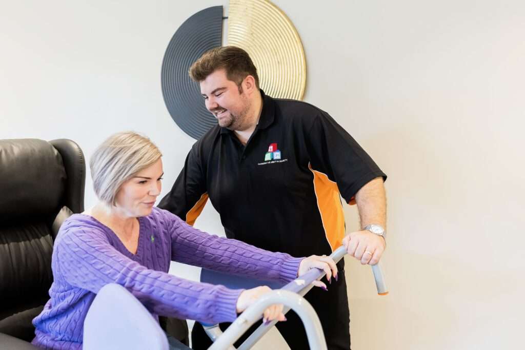 OT helping client into chair
